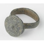 Viking Ring with Sun Symbols , ca. 900 AD, oval band with large bezel engraved with stylized sun