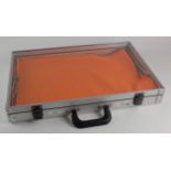 Lockable medal / badge display case (approx 52 x34.5 x 7 cm) with key under orange mat. 2nd hand (