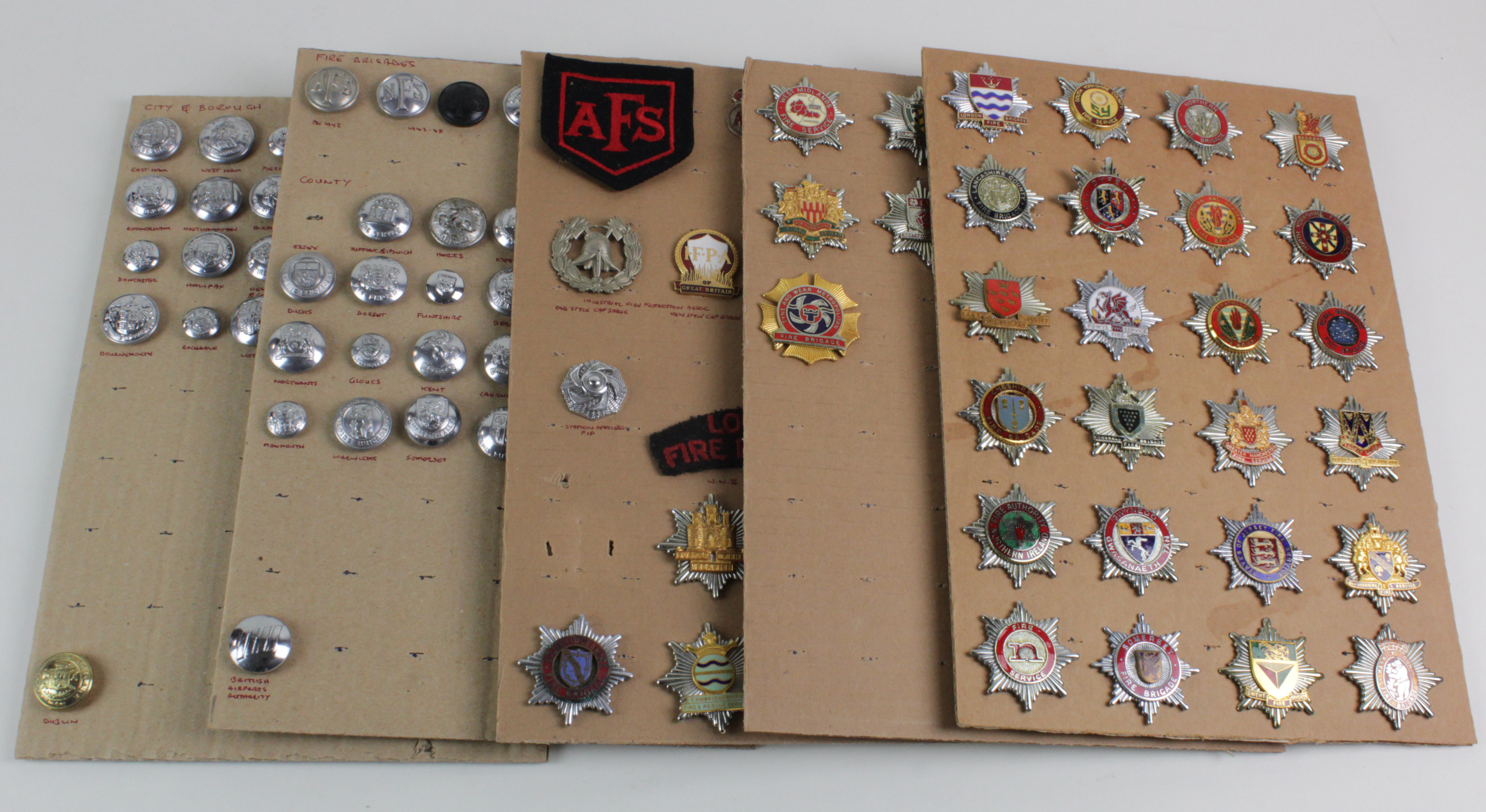 Fire Brigade - collection on boards inc Cap Badges, buttons, cloth, etc. (Qty)