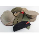 Box of various Military soft hats, a cap, a pith helmet, etc (qty) Buyer collects