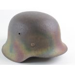 German WW2 M35 steel helmet with Normandy colour, partly lost through surface corrosion on crown,