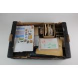 Tray with untidy accumulation of material in albums (3), loose in tins and packets, and covers,