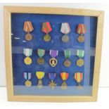 Medal collection US, Russian, French and Belgium in glassed frame. (14)