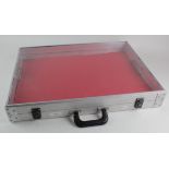 Lockable medal / badge display case (approx 60 x 44.5 x 9 cm) with key under red mat. 2nd hand (
