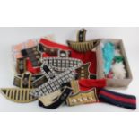 Various Guards Regiment cloth arm insignia, musicians insignia, box of Bearskin Plumes, etc. (qty)