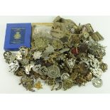 Cap badges, Helmet Plates, collars, shoulder titles, etc. Large unsorted lot (qty) may contain