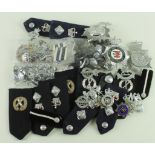 Police interest - large quantity of numbers, badges, helmet plates, high ranking shoulder boards,