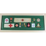 Red Cross & RAMC interest - large frame with WW1 Pair Medals, cap badges, cloth badges, arm bands,