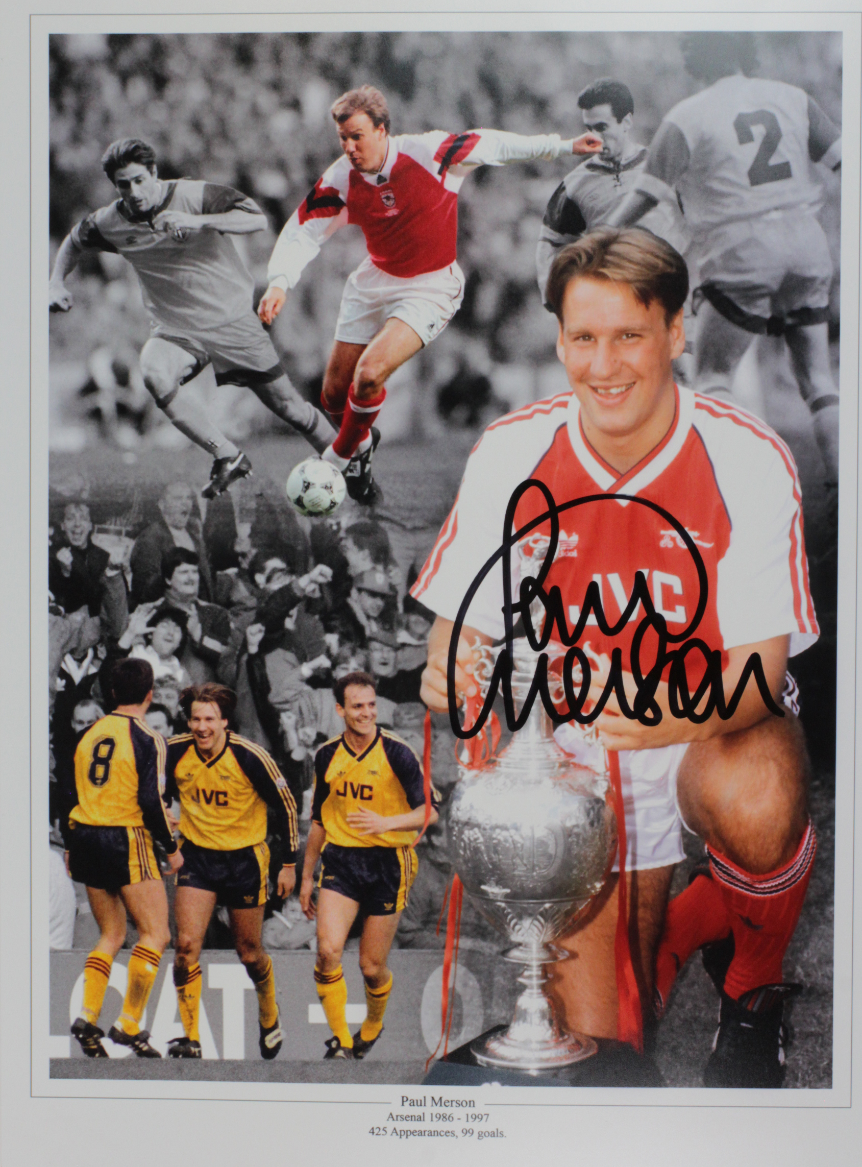 Former Arsenal Captain Kenny Sansom signed framed and mounted 16 x 12" image holding aloft the