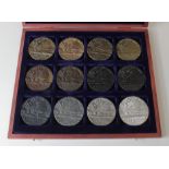 Lusitania Medals (12) a collection of cast copies in bronze and brass-like metals, iron,