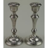 Pair of loaded silver candlesticks hallmarked B&Co. Birm, 1962. Height of each - 204mm approx