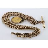 9ct gold hallmarked "T" bar pocket watch chain with a George V Half Sovereign attached. Approx