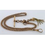 9ct gold hallmarked "T" bar pocket watch chain with tassle fob attached. Approx length 40.5cm,