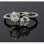 Platinum ring set with two diamonds, each calculated to weigh approx. 0.75ct. Finger size M,