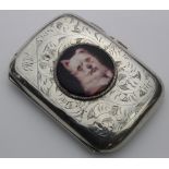 Silver and enamel cigarette case, with enamel image of a dog to lid (West Highland Terrier ?),