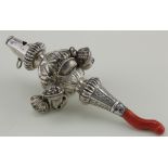 Victorian silver childs rattle by George Unite with floral decoration surrounded by eight bells,