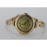 Ladies 9ct cased wristwatch, import marks for London 1924, gilt 26mm dial with arabic numerals