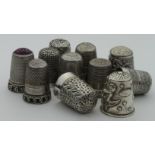 Eleven silver thimbles (hallmarked, sterling, 925 etc.), many with ornate decoration