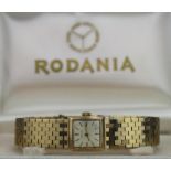 Boxed ladies 9ct cased Rodania wristwatch, hallmarked 1964. The square cream dial with gilt baton