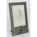 Military interest. A hammered metal picture frame with Royal Engineers insignia to base, 18cm x 11cm