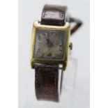 Gents 18ct cased wristwatch, import marks for London 1924. On an old leather strap, watch working