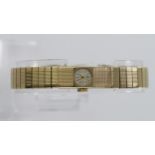 Ladies 9ct cased wristwatch by Elco. The round 9mm dial with gilt baton markers on an integral 9ct