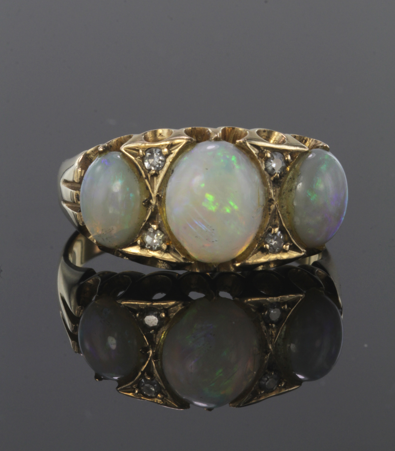 22ct yellow gold opal three stone ring with diamond highlights, finger size Q, weight 6.3g