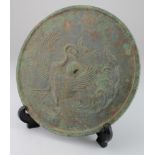 Chinese archaic bronze mirror depicting peacock, 170mm