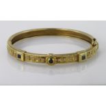 18ct yellow gold hinged bangle set with diamonds and sapphires, box clasp with safety catch.