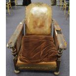Victorian oak framed gothic revival reclining armchair, with leather base, arms & back, cane