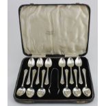 Boxed set of 12 silver teaspoons & one pair of sugar tongs (4 spoons have slightly bent bowls)