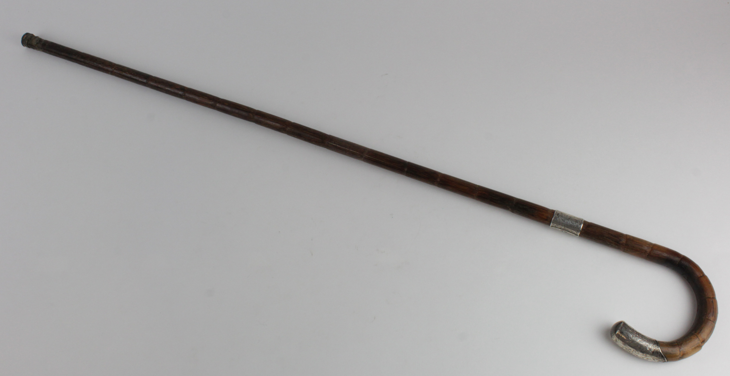 Silver mounted malacca walking stick / cane, hallmarked 'HT, London 1913', length 88cm approx.