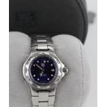 Ladies TAG Heuer Kirium quartz wristwatch. The bright blue dial with date aperture at 3 o'clock.