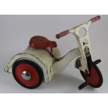 Triang Imp red & white pressed steel pedal tricycle, length 66cm approx.