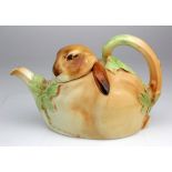 Royal Doulton Bunnykins teapot, designed by Charles Noke, depicting a rabbit with leaf decoration,