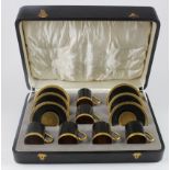 Royal Worcester. Six piece Royal Worcester black & gold coffee set, comprising six cups & saucers,