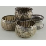 Four silver napkin rings (includes a matching pair hallmarked for Sheffield 1904) and two others