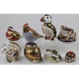 Royal Crown Derby. A collection of eight Royal Crown Derby animal paper weights, including puffin,