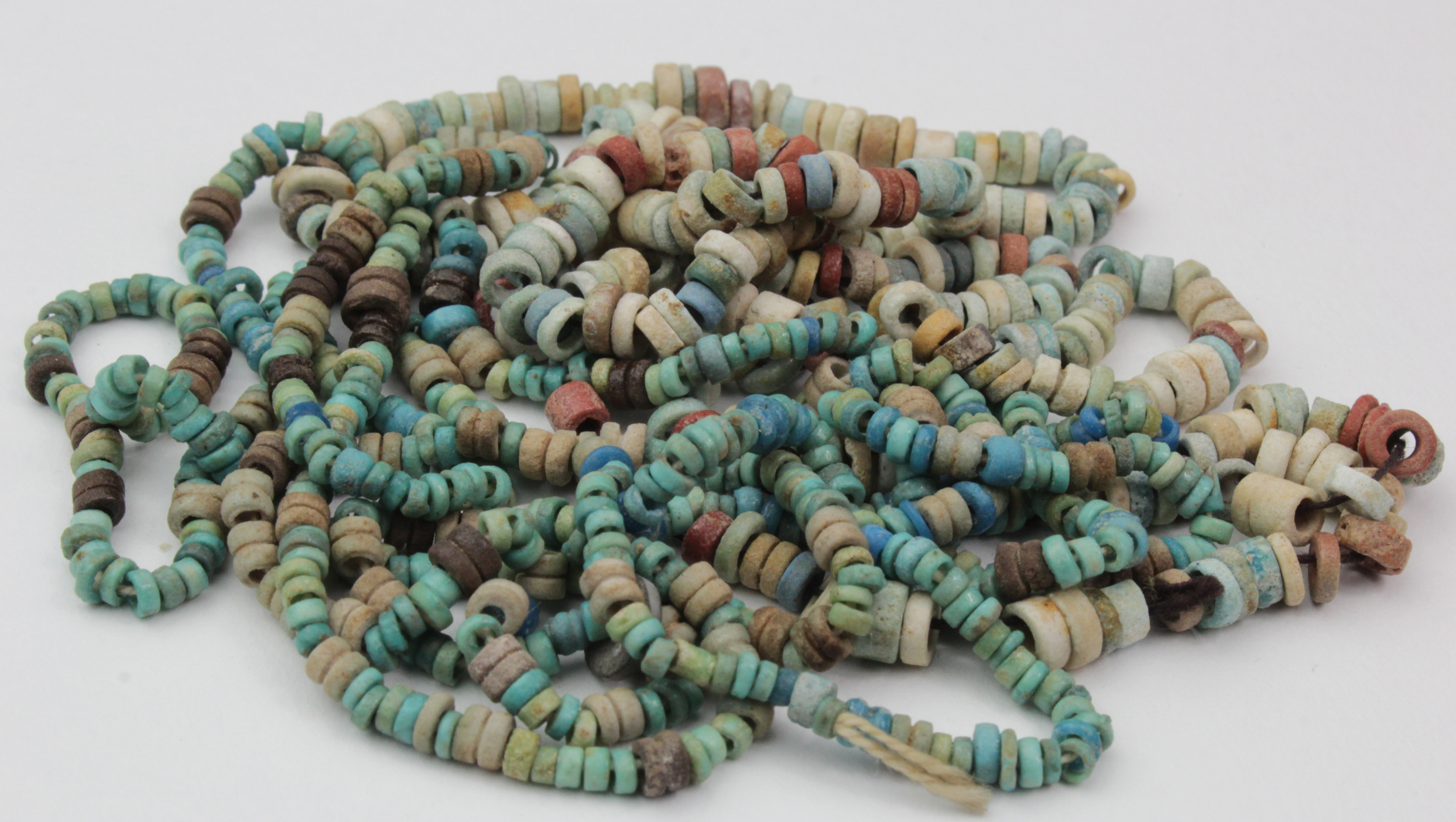 Two Egyptian bead necklaces, consisting of multicoloured beads, length 86cm & 56cm approx.