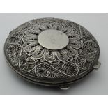 White metal ladies compact, lid decorated with filigree work, reverse depicts three camels, diameter