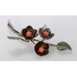 Silver floral spray brooch with three leaves and three flower heads. Hallmarked Chester 1945 by