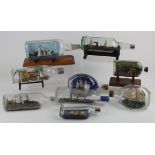 Nine model ships in glass bottles, each on a wooden stand