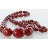 Cherry Amber / Bakelite bead necklace & bracelet, circa 1930s