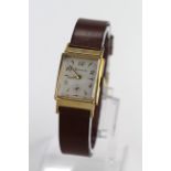 Gents Bulova 10kt gold filled wristwatch. The square cream dial with arabic / square markers &