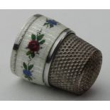 Thimble. An unusual folding enamel thimble (possibly American), with floral decoration