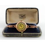 Ladies 9ct cased wristwatch on a 9ct expandable bracelet, circa 1919, In an old "Bravingtons" box