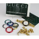 Gucci ladies wrist watch with a selection of inter changeable bezels, with some paperwork, purchased