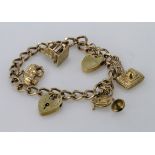 9ct gold / yellow metal charm bracelet with a few charms attached, total weight 21.4g