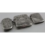Three silver vesta cases with floriate design hallmarked for Birm. 1898, 1903 & 1905. All in good