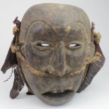Tribal interest. An African tribal mask, possibly fertility, circa late 19th to early 20th